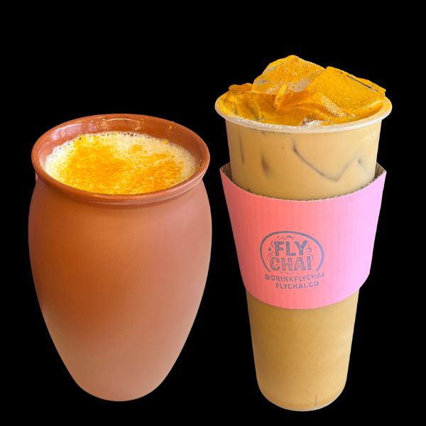 Two tropical iced drinks on a solid black background. On the left is a frothy orange drink in a terracotta-colored ceramic mug.